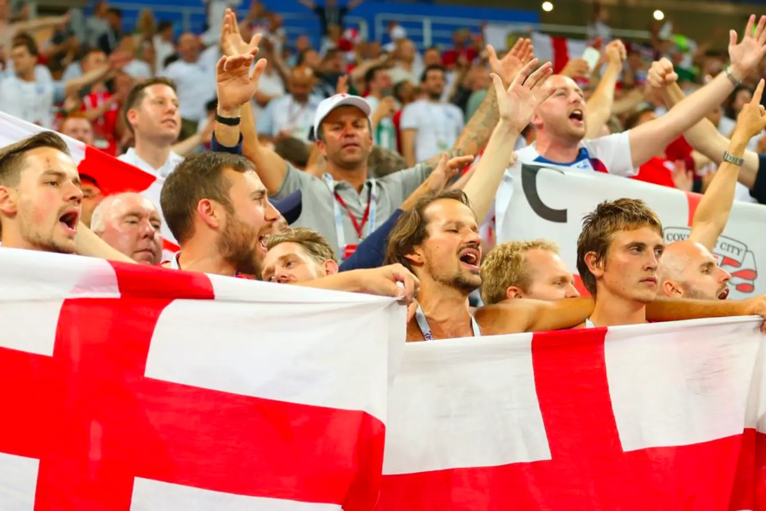 Football fans singing together